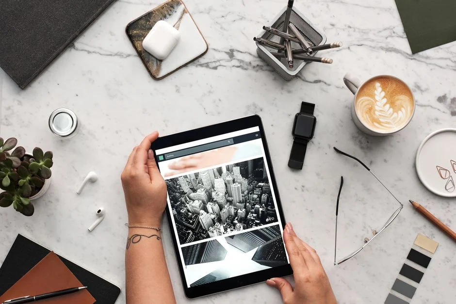 A person using a laptop to browse stock photo websites. Freelancing work in a cozy setting.